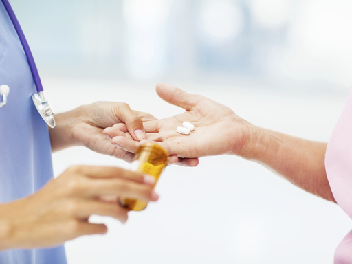 Pharma-Biotech_Doctor Handing Over Prescription to Patient